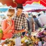 A couple is enjoying a farmer's market in Schenectady, NY.