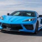 A blue 2020 Chevy Corvette racing around a test track.