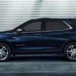 A blue 2020 Chevy Equinox is shown from the side in a parking garage after leaving a Chevy dealer near me in Albany, NY.