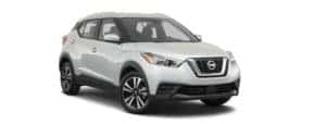 A white 2020 Nissan Kicks is facing right.