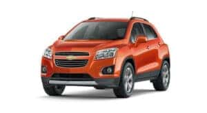 An orange 2016 Chevy Trax is angled left,