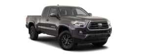 A dark grey 2020 Toyota Tacoma is facing right.
