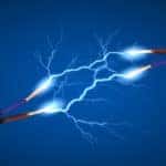 Two silver poles with red and blue cords coming out of them shooting connecting lightening bolts to one another