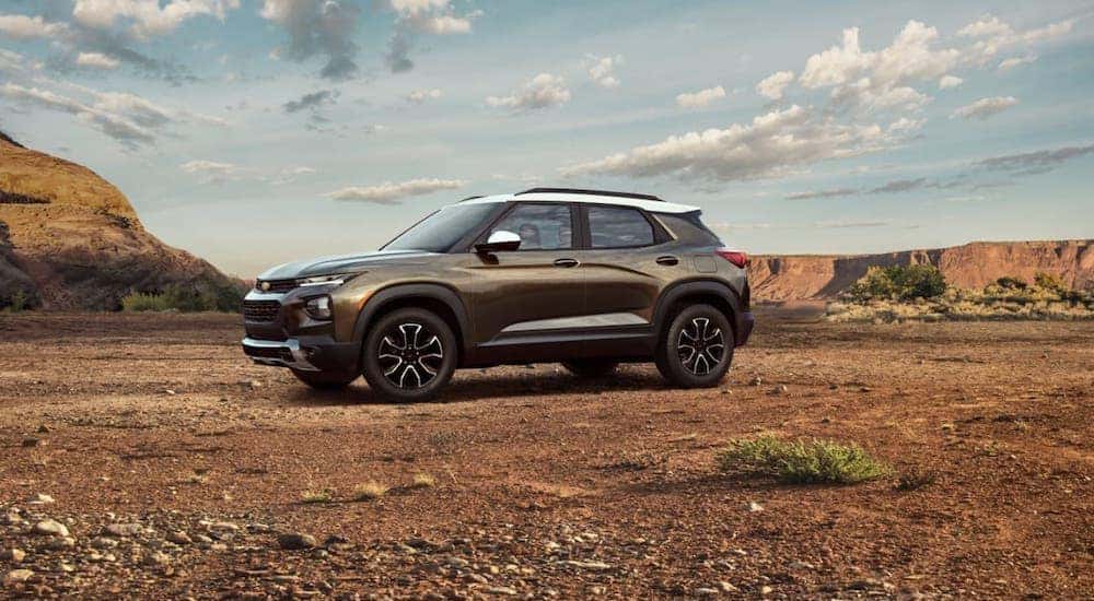 A brown and white 2021 Chevy Trailblazer is parked in a desert.