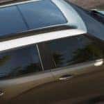 A closeup is showing the top of a brown and white 2021 Chevy Trailblazer from a Chevy dealership near Clifton Park, NY.