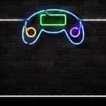 Black brick wall with a purple, green, yellow, and blue LED gaming controller outline on it