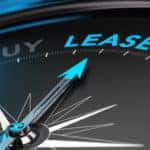 Black compass with the words "Buy, Lease, Buy" around the outer rim with "lease" lit up in a bright blue