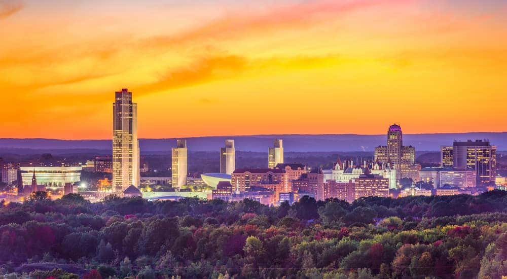 Tall, lit up city buildings in Albany NY