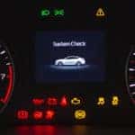 Dashboard of a vehicle with many warning lights lit up on it