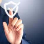 Man in a blue blazer holding his finger out to touch a floating white checkmark