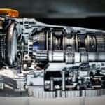 Silver vehicle transmission isolated and sitting on a white table