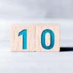 Two brown blocks with blue numbers on them that make out "10"