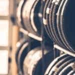Tires lined up on metal shelves in a tire shop