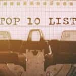 Piece of grid paper sitting in a typewriter with the words "TOP 10 LIST" typed on it