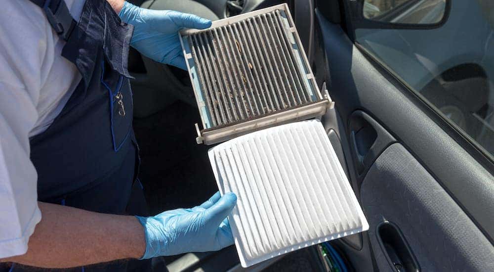 A side-by-side is shown of a new and a used cabin air filter.