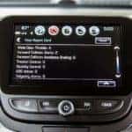 A closeup shows a safety report on the infotainment screen in a 2020 Chevy Equinox at a Albany Chevy dealer.