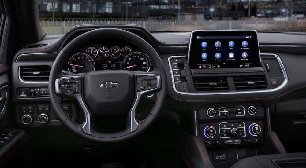 The black interior of a 2021 Chevy Tahoe is shown.