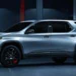 A silver 2021 Chevy Traverse Redline is shown from the side after leaving a Schenectady Chevy dealer.