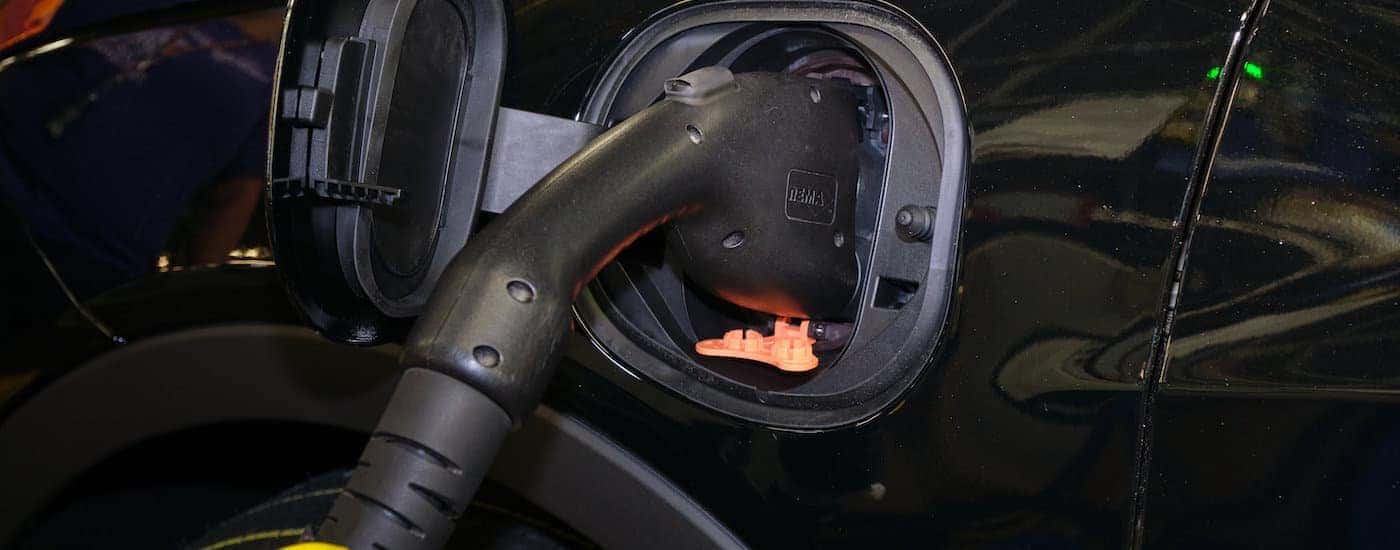 A black 2022 Chevy Bolt EV is shown charging.