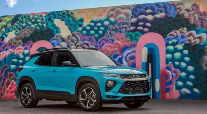 A teal 2021 Chevy Trailblazer RS is shown parked in front of a mural after leaving an Albany Chevy crossover dealer.