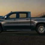 A silver 2021 Chevy Silverado 1500 is parked on a track after leaving a Chevy 1500 diesel dealer.