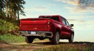 A red 2021 Chevy Silverado LT Z71 is shown from the rear on a path.