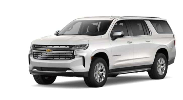 A white 2022 Chevy Suburban is angled left.