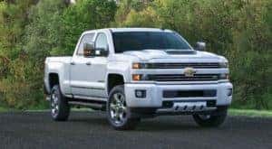 A white 2017 Chevy Silverado 2500HD is shown parked at an Albany certified pre-owned Chevy dealer.