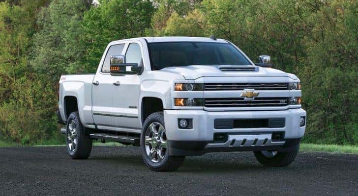 A white 2017 Chevy Silverado 2500HD is shown parked at an Albany certified pre-owned Chevy dealer.