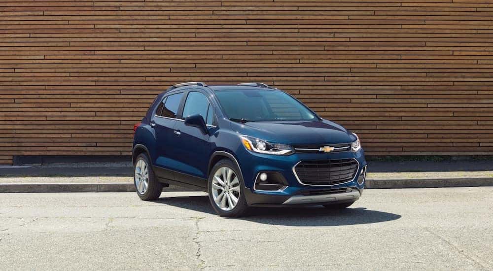 A blue 2018 Chevy Trax is shown parked outside of an Albany certified pre-owned Chevy dealer.