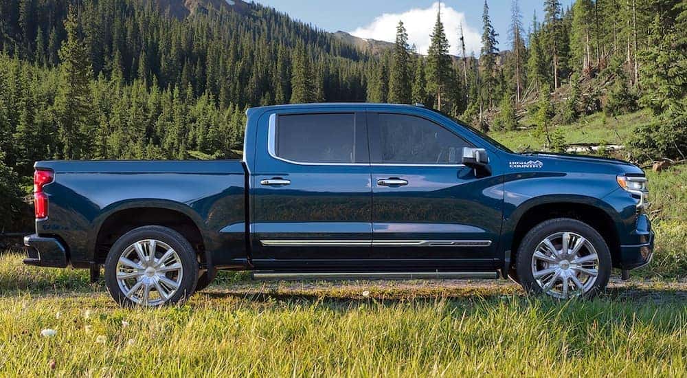 A 2021 Chevy Silverado 1500 High Country is shown from the side after leaving an Albany certified pre-owned cars and trucks dealer.