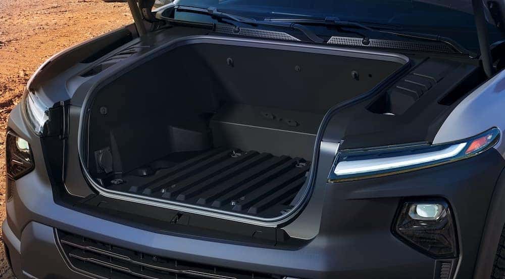 A close up of the eTrunk on a silver 2024 Chevy Silverado EV WT