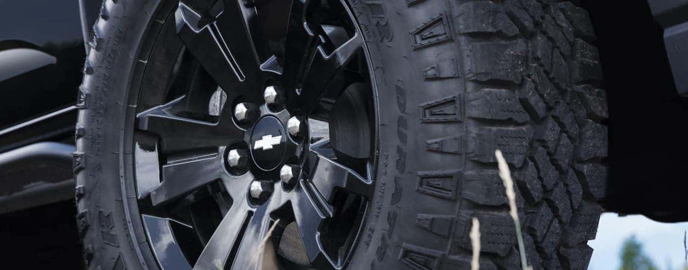 The black tire of a 2022 Chevy Colorado is shown in close up.