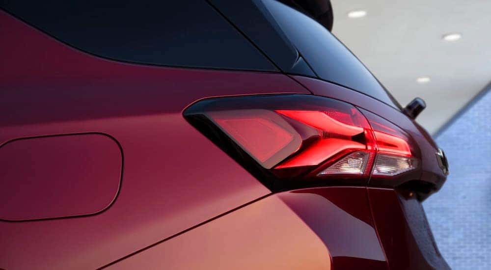 A close up shows the driver side taillight on a red 2022 Chevy Equinox RS.