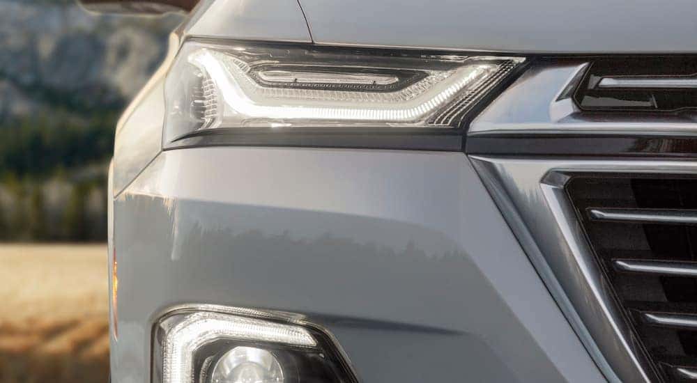 A close up shows the passenger side headlight on a 2022 Chevy Traverse Premium.