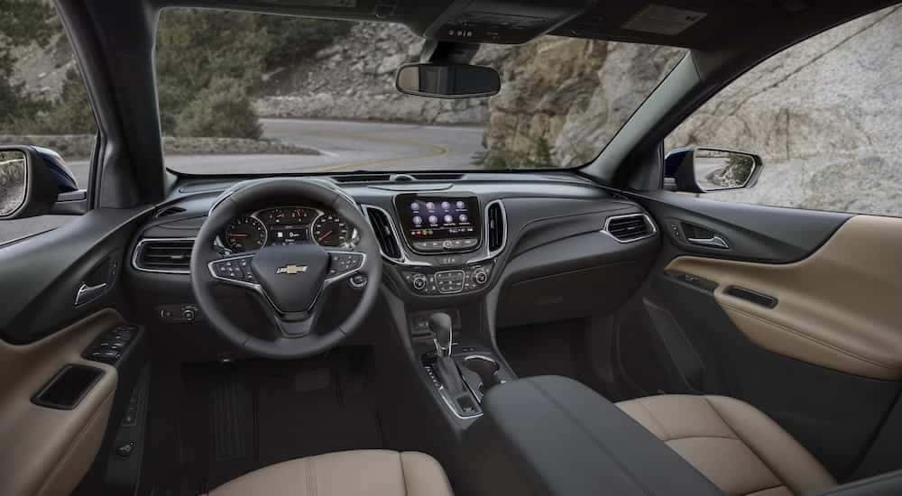 The interior of a 2022 Chevy Equinox Premier is shown from the drivers seat.