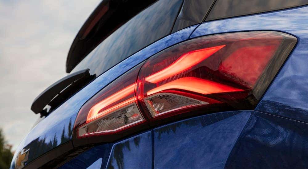 A close up shows the passenger side taillight on a blue 2022 Chevy Equinox Premier.
