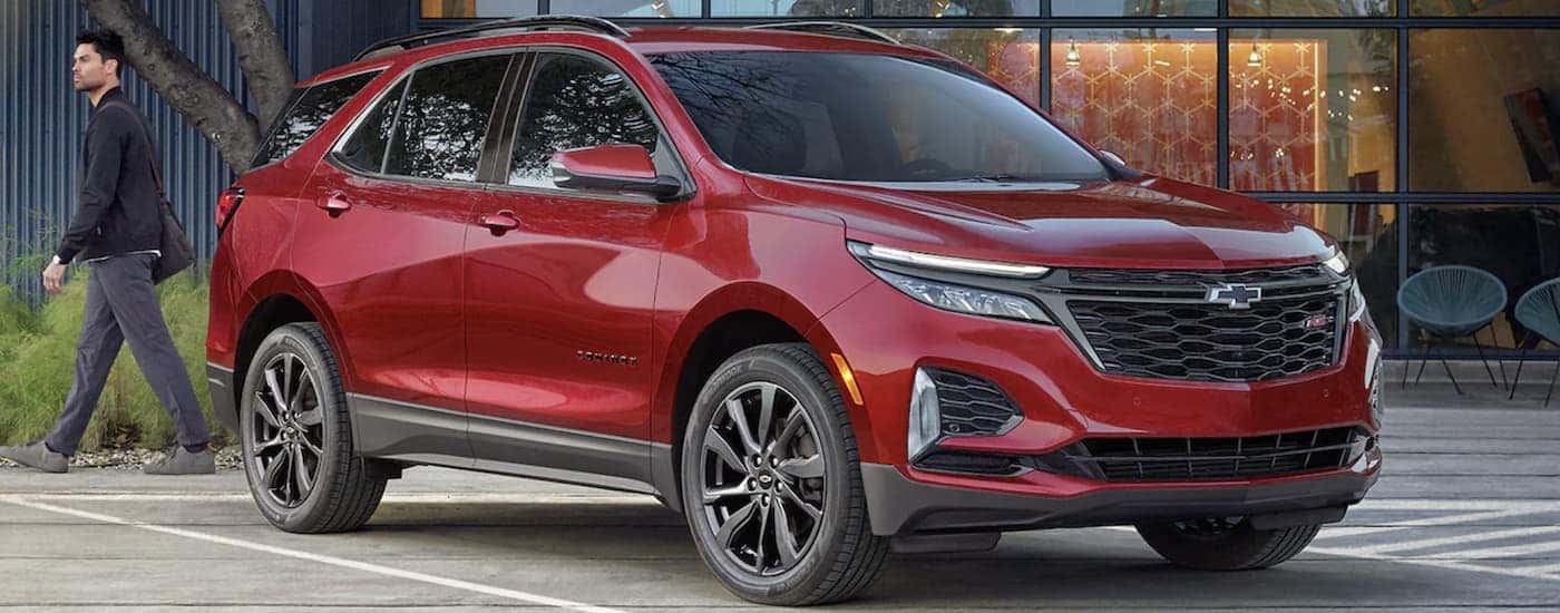 A red 2022 Chevy Equinox RS is shown from the front parked after leaving a Chevy Equinox dealer.