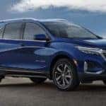 A blue 2022 Chevy Equinox is shown from the side parked in front of an ocean after leaving a Chevy Equinox dealer near you.