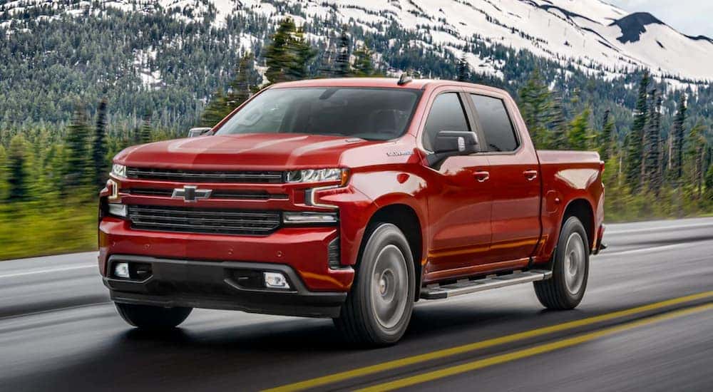 A red 2020 Chevy Silverado is shown from the front at an angle after leaving a certified used Chevy dealer.
