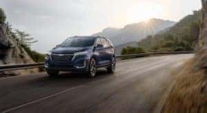 A blue 2022 Chevy Equinox is shown from the front at an angle after leaving a Troy Equinox dealer.