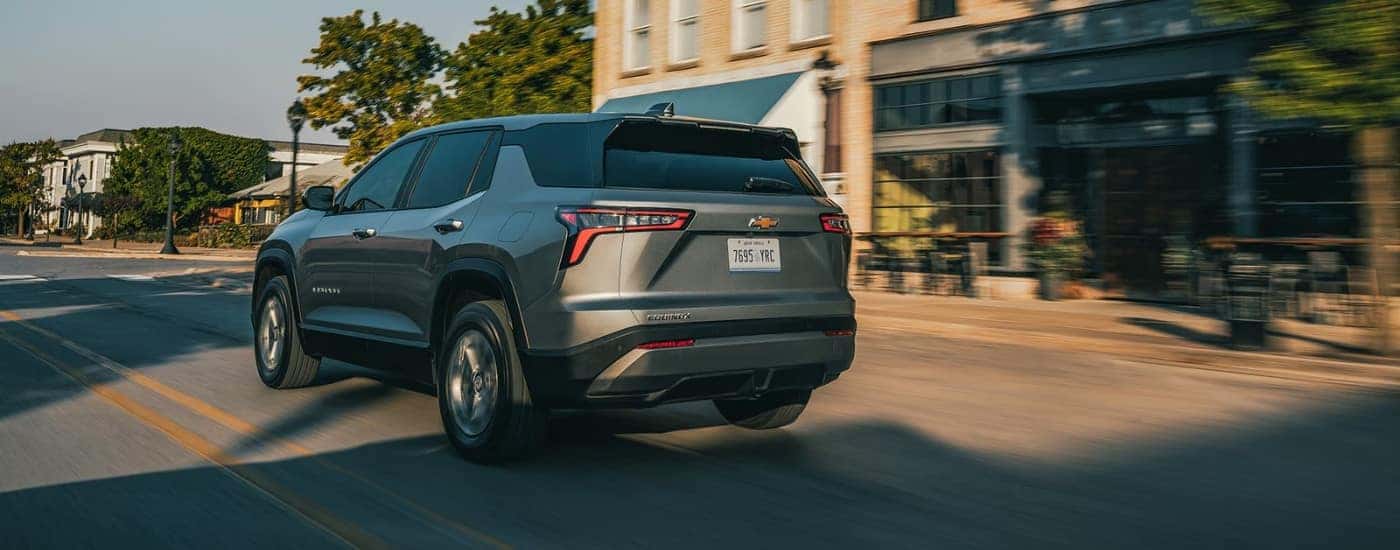 Grey 2026 Chevy Equinox LT driving on a city street