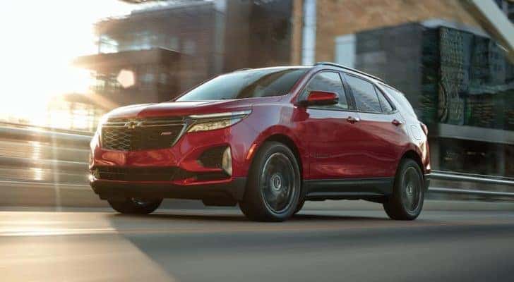 A red 2022 Chevy Equinox is shown after leaving an Albany Equinox dealer.