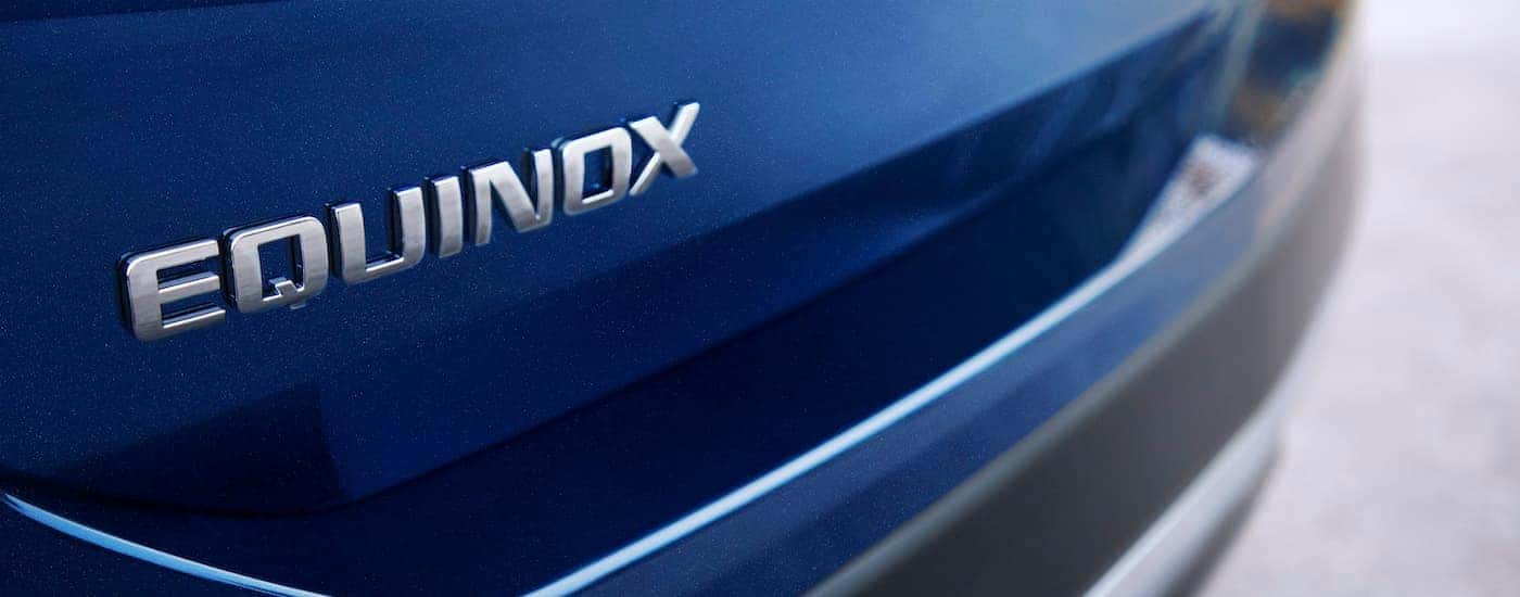 A close up shows the Equinox badge on a 2022 Chevy Equinox Premier.