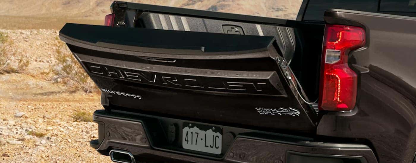 A close up of the tailgate on a black 2022 Chevy Silverado 1500 High Country for sale is shown.