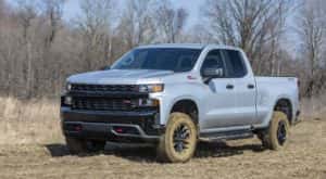 A silver 2022 Chevy Silverado Z71 Trail Boss is shown from the front at an angle.