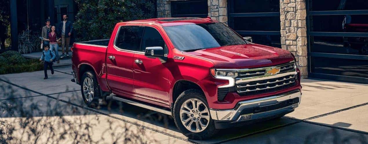 A red 2023 Chevy Silverado Z71 is shown during a 2023 Chevy Silverado 1500 vs 2023 Ram 1500.
