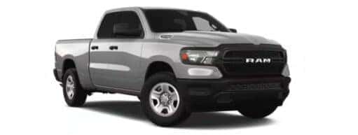 A silver 2023 Ram 1500 Tradesman is angled right.