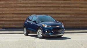 A blue 2018 Chevy Trax is shown parked at a certified used SUV dealer.