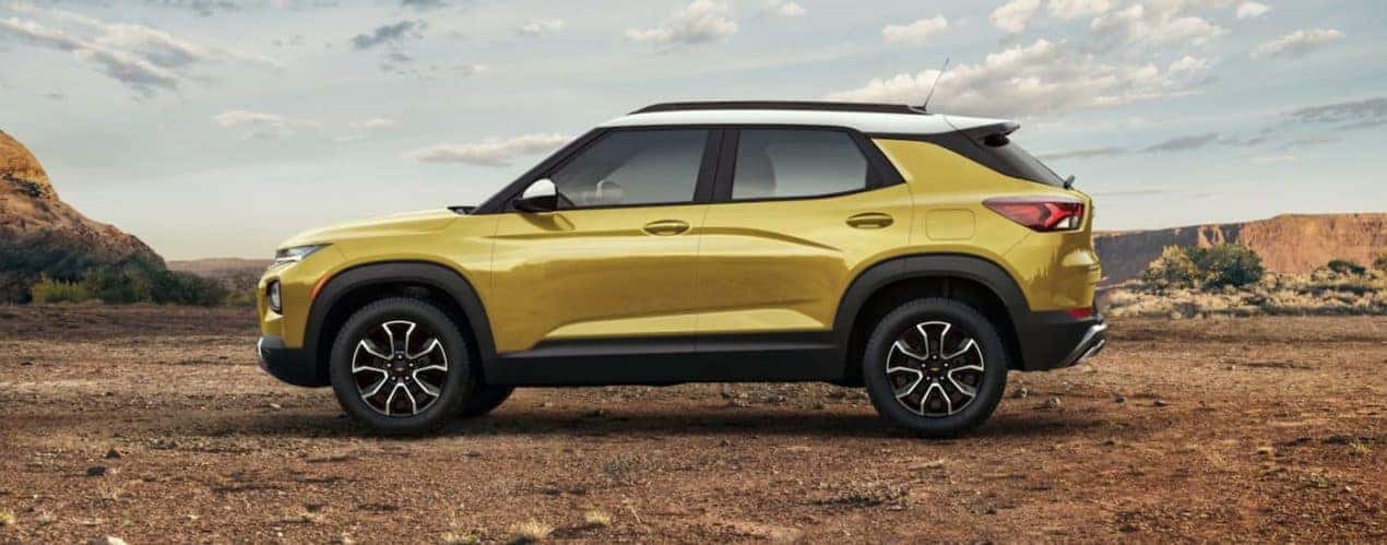 A yellow 2023 Chevy Trailblazer Activ is shown from the side during a 2023 Chevy Trailblazer vs 2023 Honda HR-V comparison.